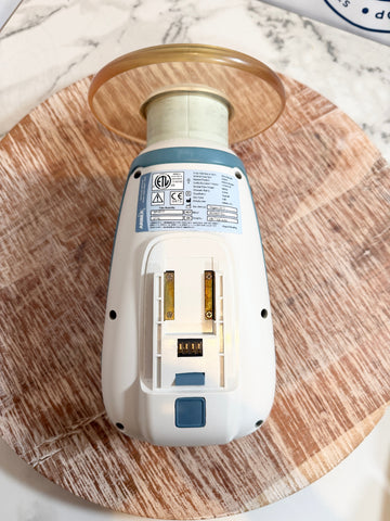 Aribex Nomad Pro Handheld Dental Intraoral System with blue accents on a wooden surface