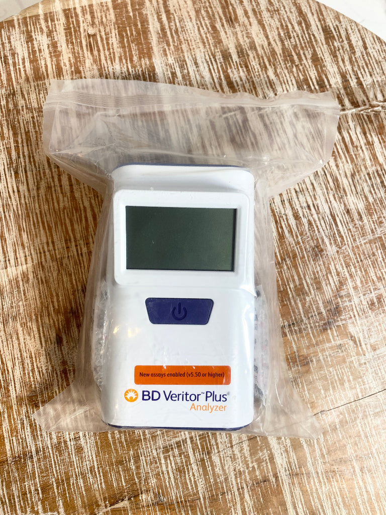 BD Veritor Plus Analyzer on a wooden surface