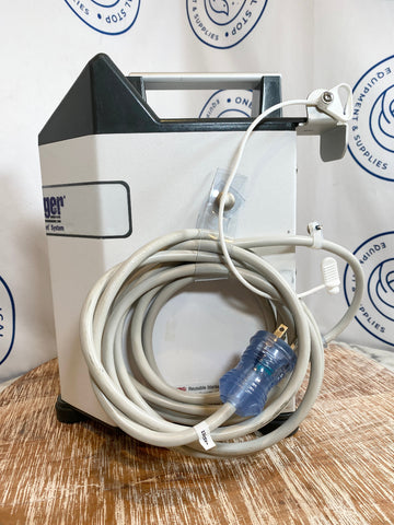 Bair Hugger medical device on a wooden surface with power cord