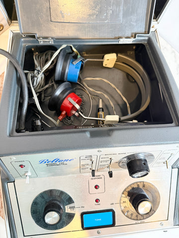 Beltone 120 Audiometer with open lid showing internal components.