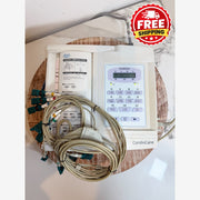 CardioCare cardiac monitor with attached lead wires and a printed instruction booklet, placed on a round wooden tray with a red 'FREE SHIPPING' badge overlay in the top right corner.