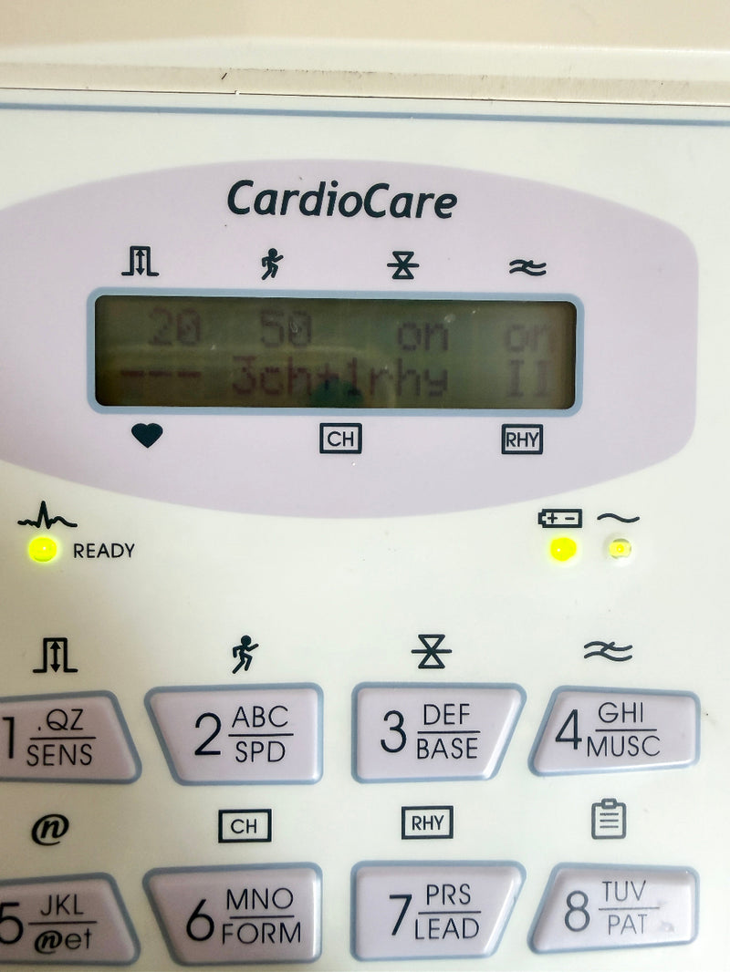 Close-up of a CardioCare automatic heart rate monitor keypad with an LCD display screen and numbered button keys on a white device.