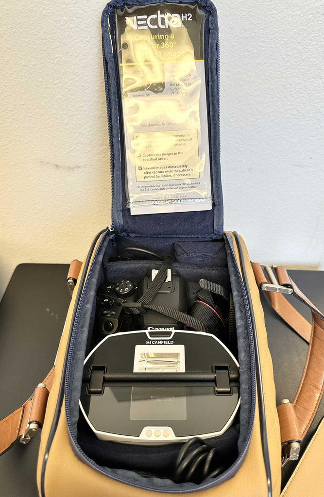 Picture of the Canfield Vectra H2 3D Face and Body Imaging Camera inside a carryon bag
