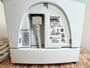 Close-up of the back panel of a Chattanooga Intelect Legend XT 2760 device showing the power cord, serial number label, and certification stickers.