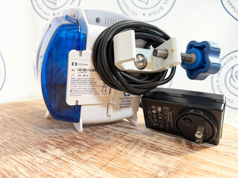 Electrical components of Kangaroo ePump device with black cable, and black power adapter 