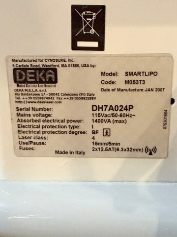 A close-up of a product label sticker on a white surface. The label shows the brand DEKA and indicates the product is a SMARTLIPO model with serial number DH7A024P.