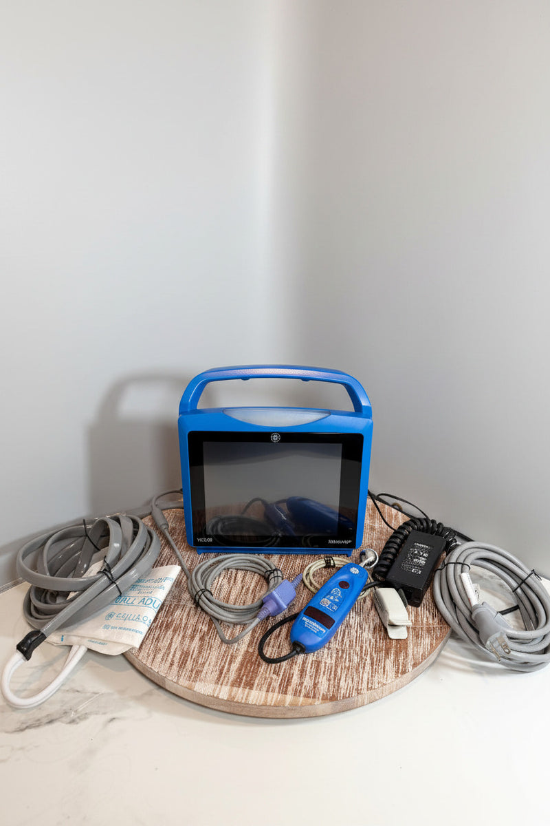 Blue GE Carescape Dinamap VC150 Vital Signs Monitor device with cables and connections.