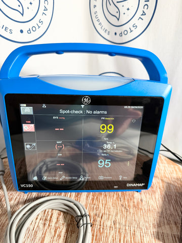 Blue GE Carescape Dinamap VC150 Vital Signs Monitor device with digital display on a wooden surface