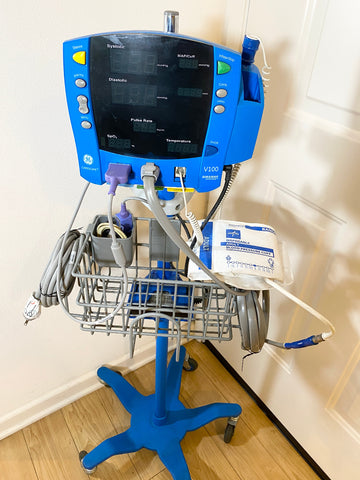 GE Dinamap CareScape V100 Vital Signs Monitor with digital display on wheel