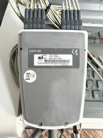 GE EKG machine handheld device closed up view.