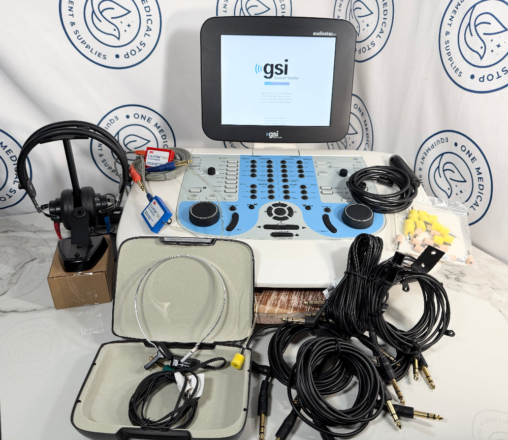 A GSI portable ultrasound machine kit with a white and blue console, monitor screen, multiple black cables, an open carrying case with internal cables, and a separate ultrasound probe mounted on a stand, displayed on a white surface against a branded backdrop.