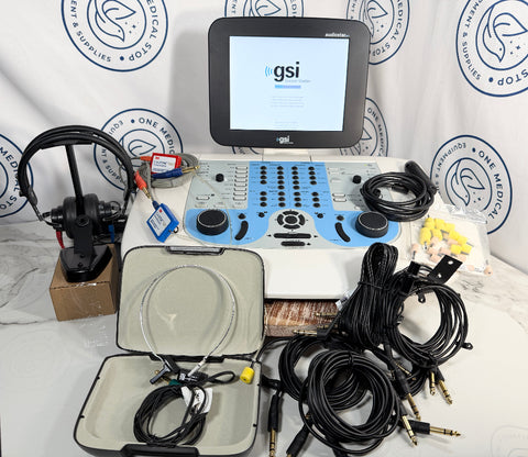 A GSI portable ultrasound machine kit with a white and blue console, monitor screen, multiple black cables, an open carrying case with internal cables, and a separate ultrasound probe mounted on a stand, displayed on a white surface against a branded backdrop.
