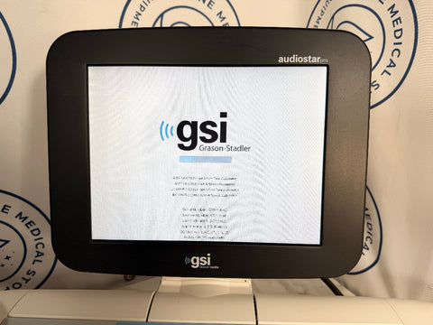A GSI audiostar touchscreen display monitor showing the GSI Grason-Stadler screen, set against a white backdrop with circular blue medical store logos.