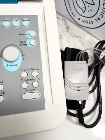 GSI TympStar electronic device with control panel and power cord on a white surface