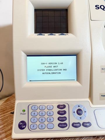 Medical device with digital display and control panel on a wooden surface