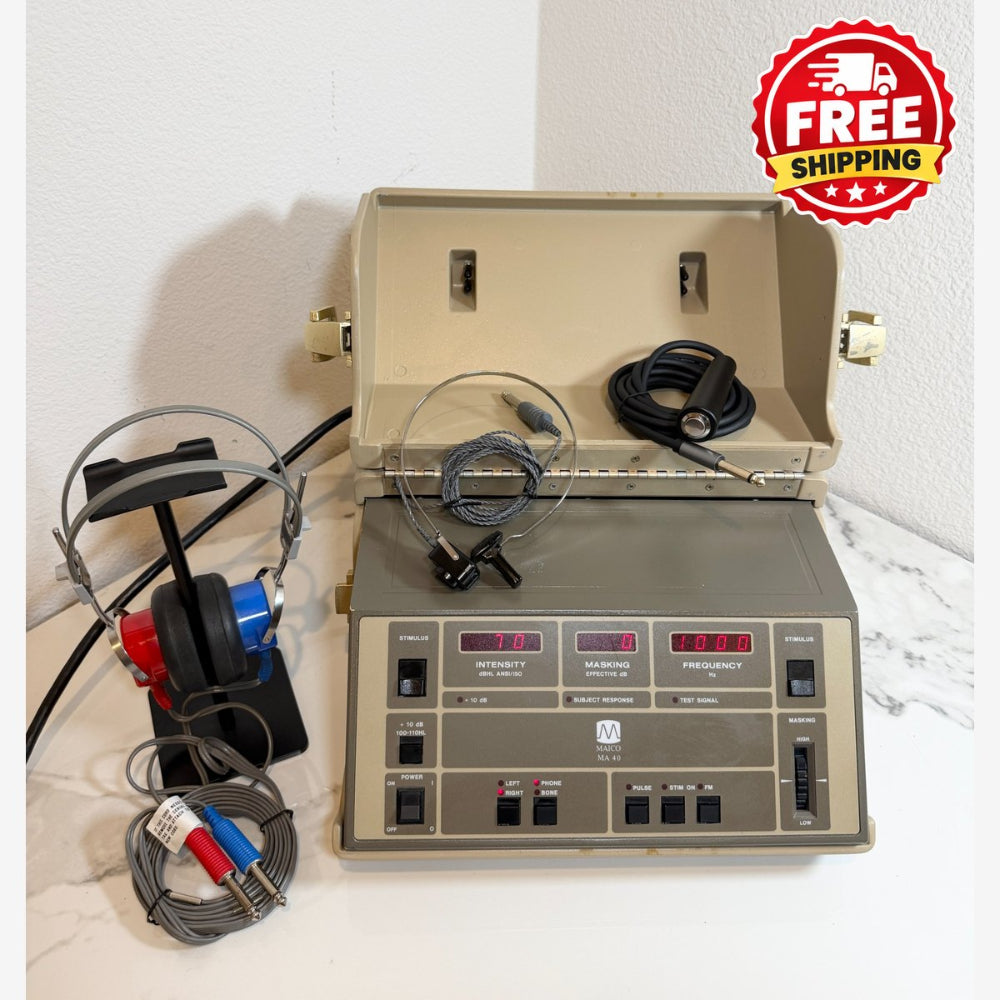 A Maico MA40 Portable Diagnostic Audiometer device with its open carrying case, headphones, and earpiece leads on a white marble surface against a white wall. A red and yellow 'FREE SHIPPING' badge is in the top right corner.