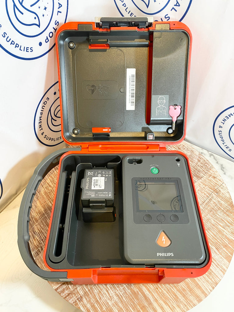 Open orange case with Philips Heartstart FR3 AED Defibrillator and battery 