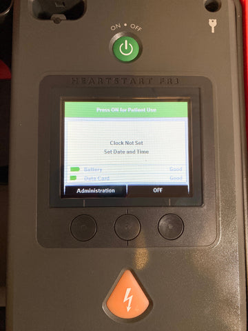 Philips Heartstart FR3 AED Defibrillator with screen displaying 'Clock Not Set' message