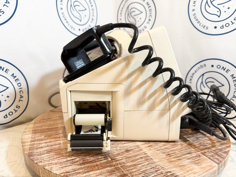 Medical device on a wooden surface with branded background