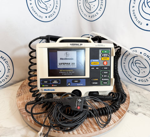 Medtronic Lifepak 20 defibrillator on a wooden stand with branded background