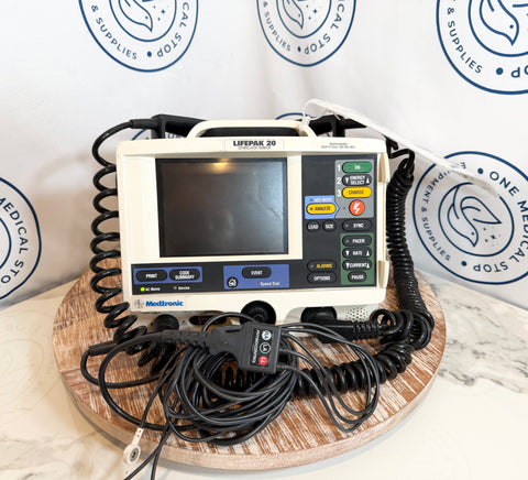 Medtronic Lifepak 20 defibrillator on a wooden stand with a white background featuring Medtronic logos.