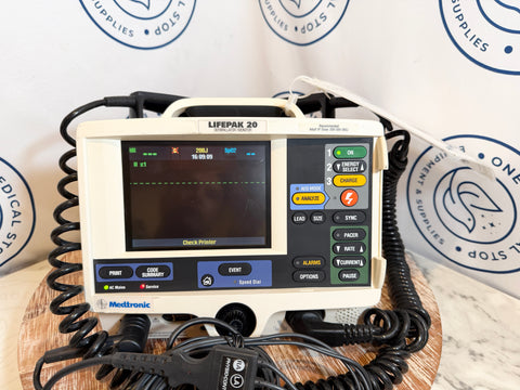 Heart monitor device on a wooden surface with branded background