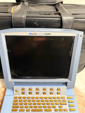 A blue SonoSite MicroMaxx Portable Ultrasound System with a black screen and gold/yellow keyboard keys, shown in front of a black carrying case.