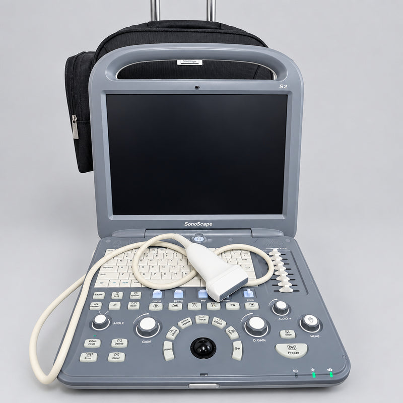 A Sonoscape ultrasound machine with a gray console, black screen, and attached white probe cable, placed on a round wooden tray with a black carrying case behind it.