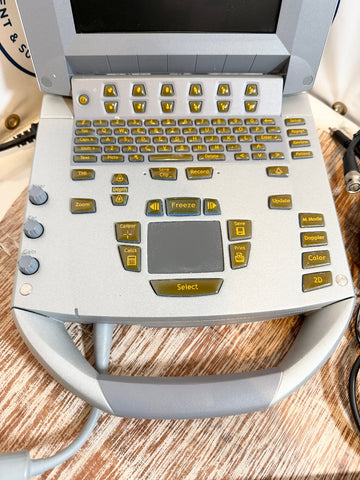 Sonosite Titan Ultrasound machine buttons display on a wooden surface