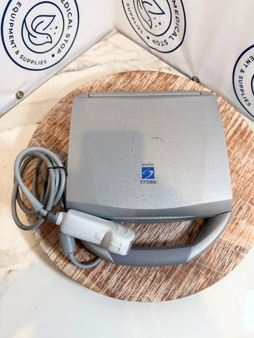 Sonosite Titan Ultrasound with cable on a wooden surface, branded 'Titan' by General Electric.