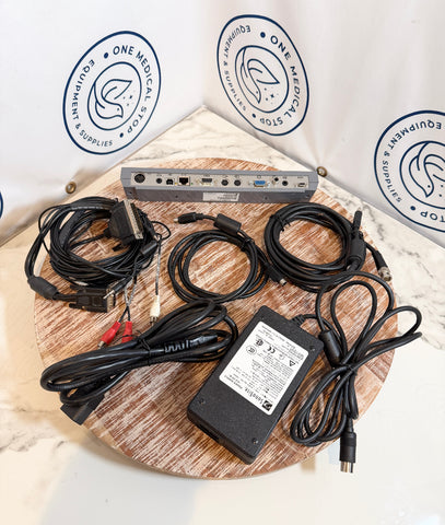 Sonosite Titan Ultrasound including cables and a power adapter on a wooden board 