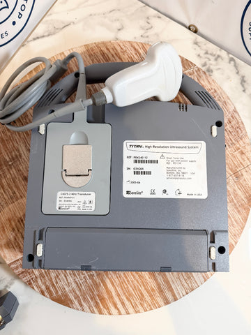 Back view of Sonosite Titan Ultrasound device on a wooden surface