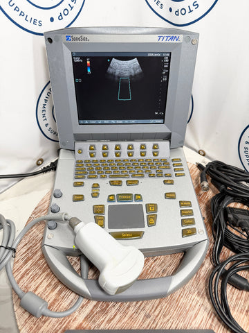 Sonosite Titan ultrasound machine on a wooden surface with cables