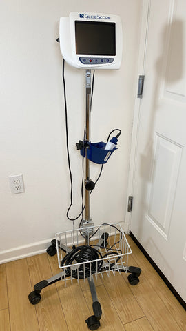 Full view of GlideScope medical device with holding tray and power cord