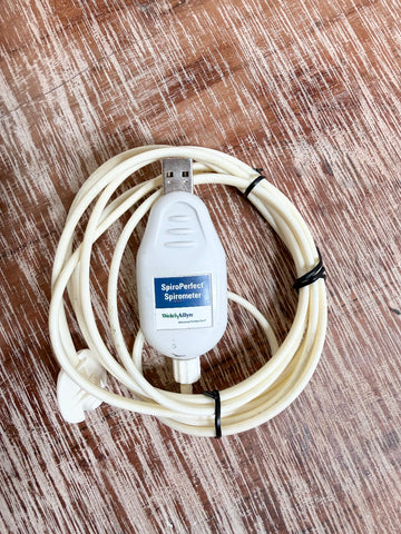A Welch Allyn SpiroPerfect 703554 USB Spirometer Sensor coiled white USB spinal cord stimulator cable.