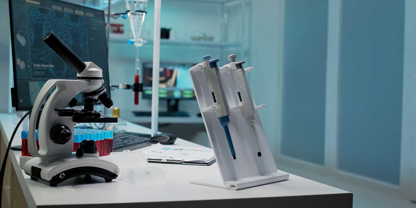 Medical laboratory microscope and other equipment placed on a table