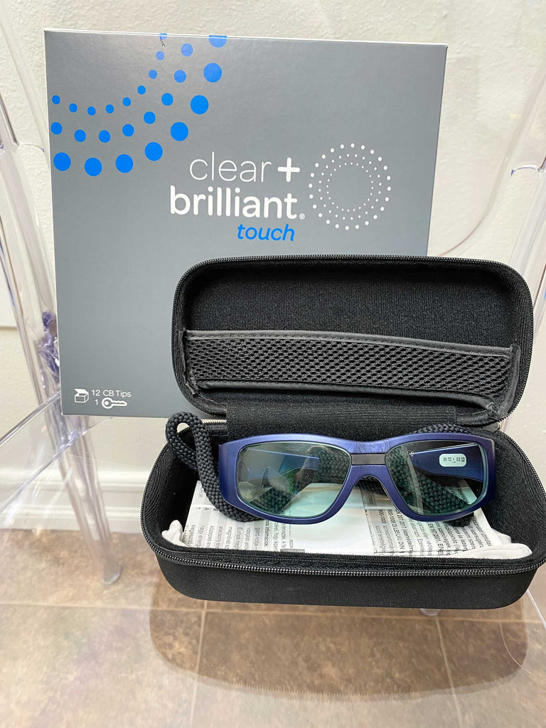 Picture of the manual and protection glasses for 2021 Solta Clear + Brilliant Touch Laser