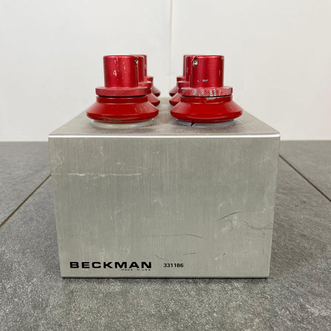Side picture of the BECKMAN CENTRIFUGE SWING ROTOR BUCKET 6 TUBES 117.3 W Holder 331186 with the writing Beckman Logo!