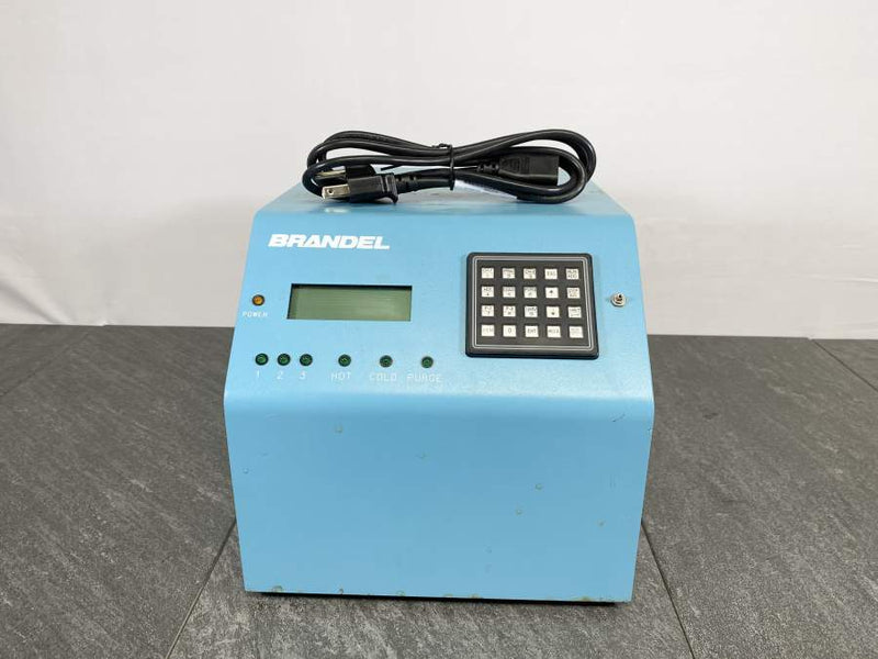 Front picture for Brandel Cell Harvester CH-055 Control Module with a power cord placed on top 