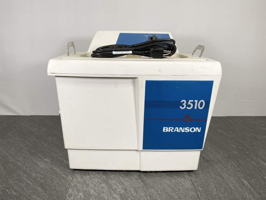 Front picture of the Branson 3510 Ultrasonic Cleaner  with a power cord placed on top