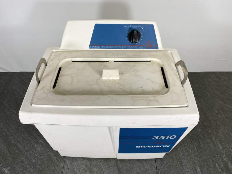 Picture of the Branson 3510 Ultrasonic Cleaner  from the top that shows some discoloration on the lid