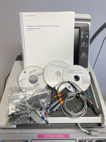 Picture of  the CDs and Manual for GE Mac 5500HD EKG Machine 