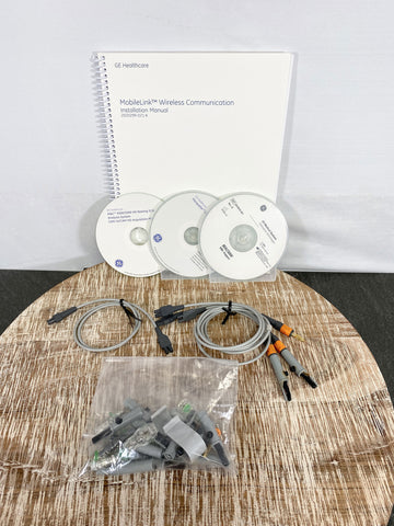 Picture of the CDs and Manual for GE Mac 5500HD EKG Machine 