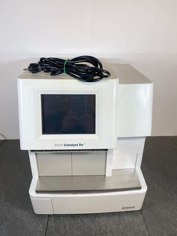 Picture of IDEXX Catalyst DX Blood Chemistry Analyzer Machine with a power cord placed on top of it