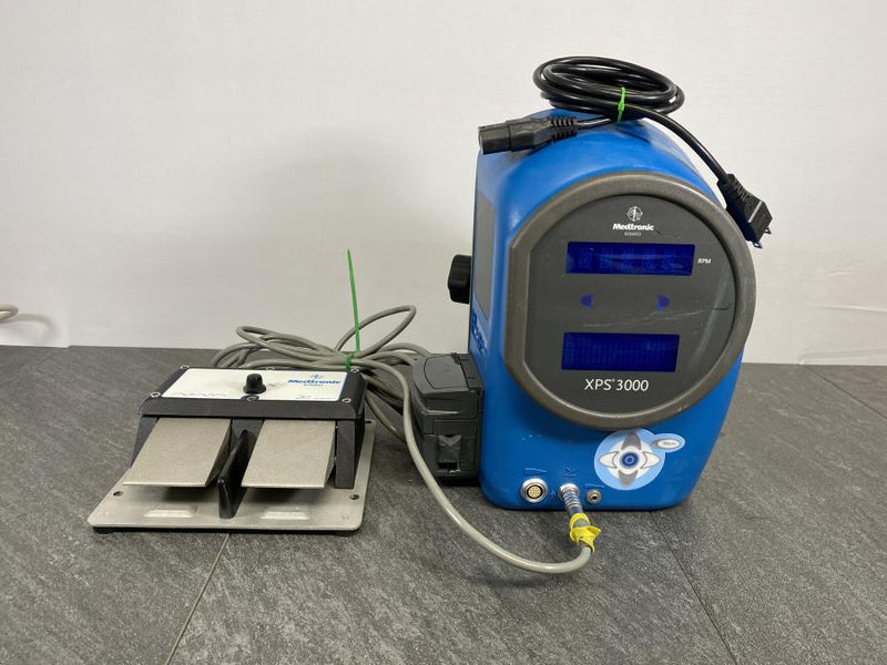 Front picture of the Medtronic XOMED XPS 3000 Irrigation Console with a foot switch and a power cord