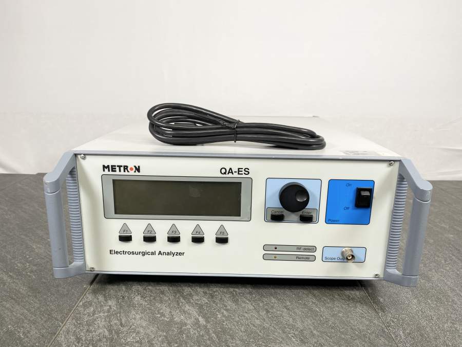 Front picture for Metron QA-ES Electrosurgical Analyzer  with a power cord placed on top