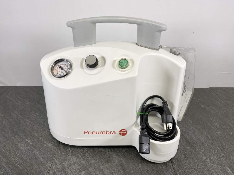 Front picture for Penumbra PMX110 Aspiration Vacuum Pump  with a power cord placed on top