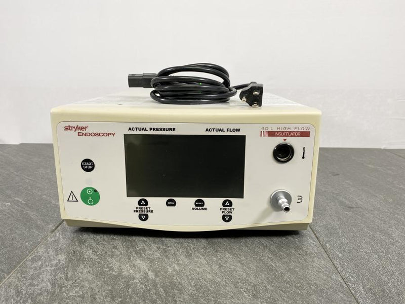 Picture of the Stryker Medical 40L HighFlow Insufflator with a power cord placed on it